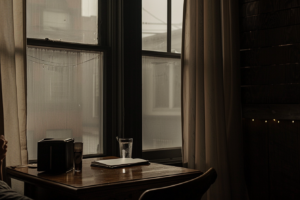 quiet morning scene person seated at a simple table f91a89e6 3f9f 4d37 b094 b03f07feb2f9 0